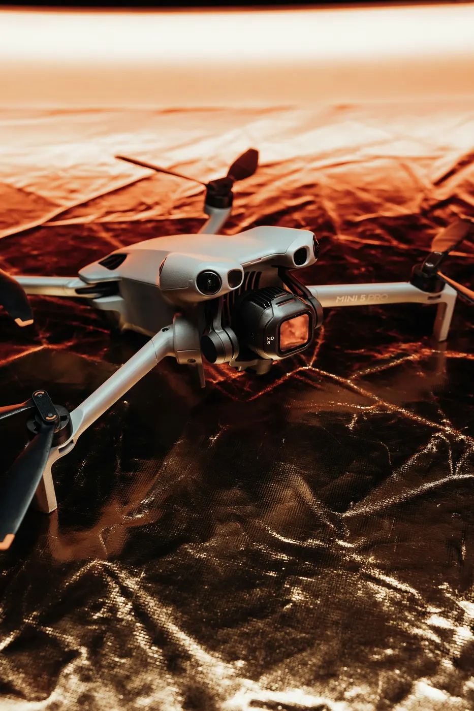 A folded survey drone on rocky ground